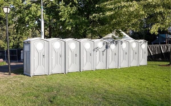 Construction site portable toilets positioned near an active Somerville, MA job site